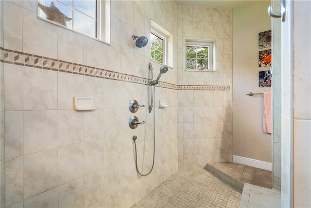 bathroom with a tile shower