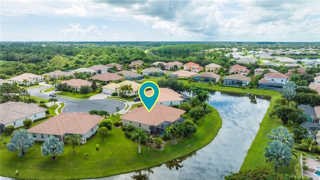 drone / aerial view with a water view