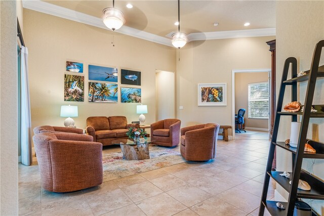 tiled living room with ceiling fan and ornamental molding