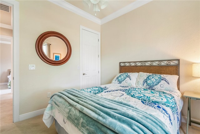 carpeted bedroom with ornamental molding