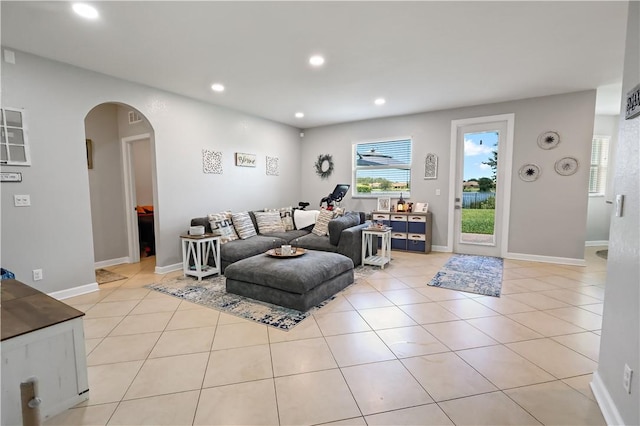 1782 Berkshire Cir SW, Vero Beach, FL 32968 - living area featuring arched walkways, recessed lighting, and light tile patterned flooring