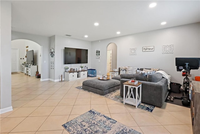 1782 Berkshire Cir SW, Vero Beach, FL 32968 - tiled living room with arched walkways and recessed lighting