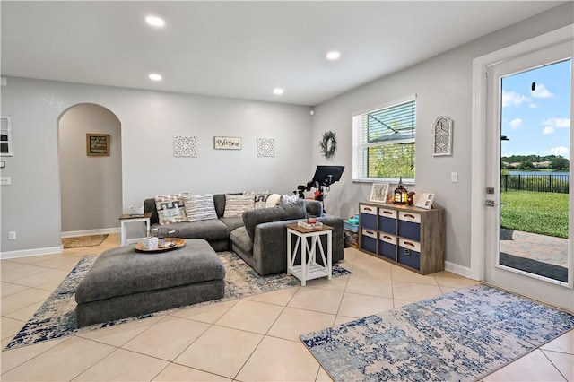 1782 Berkshire Cir SW, Vero Beach, FL 32968 - living room with arched walkways, tile patterned flooring, and recessed lighting