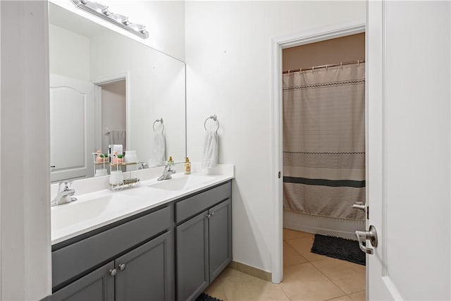 1782 Berkshire Cir SW, Vero Beach, FL 32968 - bathroom with double vanity, tile patterned floors, and curtained shower