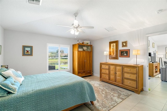 tiled bedroom with ceiling fan