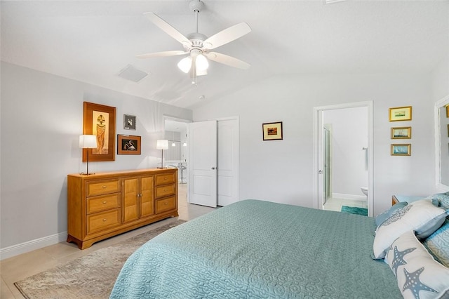 tiled bedroom featuring vaulted ceiling, ceiling fan, a closet, and connected bathroom