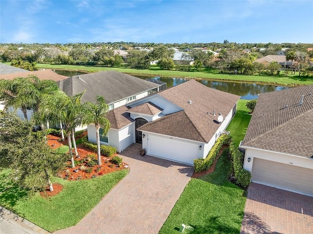 birds eye view of property with a water view