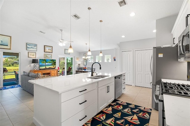 kitchen with sink, an island with sink, white cabinetry, and appliances with stainless steel finishes