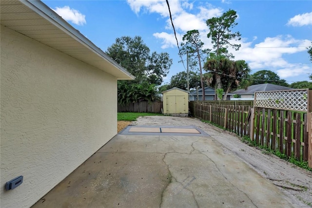 6245 6th Pl, Vero Beach, FL 32968 - fenced backyard with a storage shed and a patio