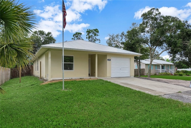 single story home featuring a front lawn and a garage