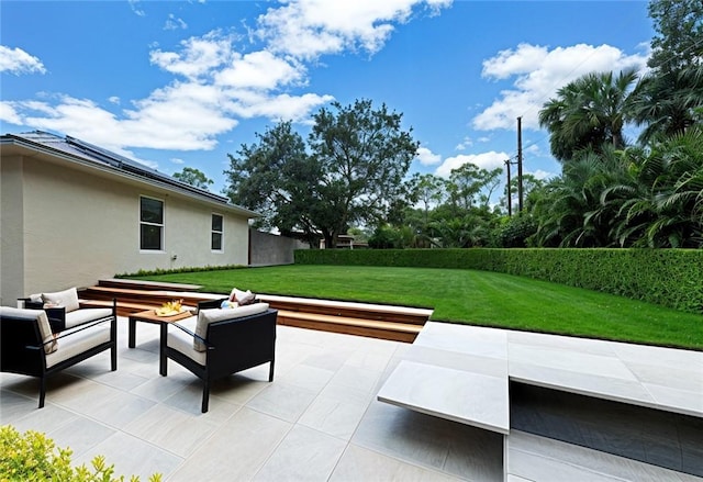 6245 6th Pl, Vero Beach, FL 32968 - view of patio with an outdoor living space with a fire pit