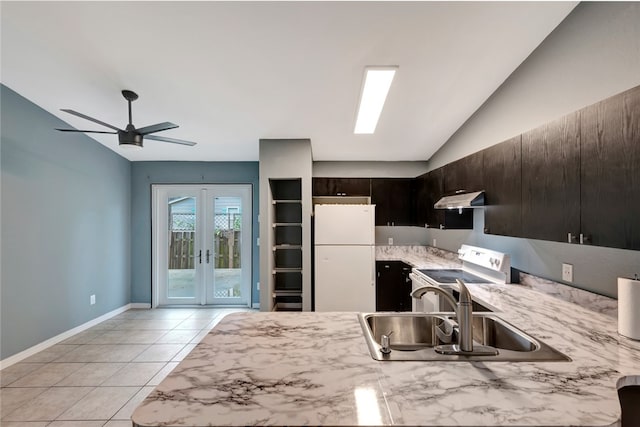 kitchen featuring white fridge, dark brown cabinetry, stainless steel electric range oven, sink, and vaulted ceiling