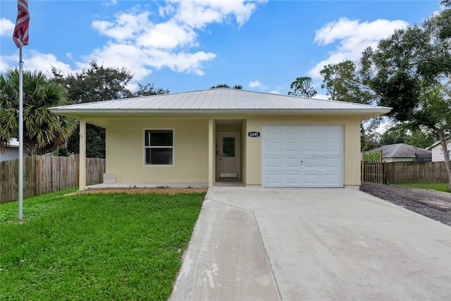 ranch-style house featuring a garage and a front yard