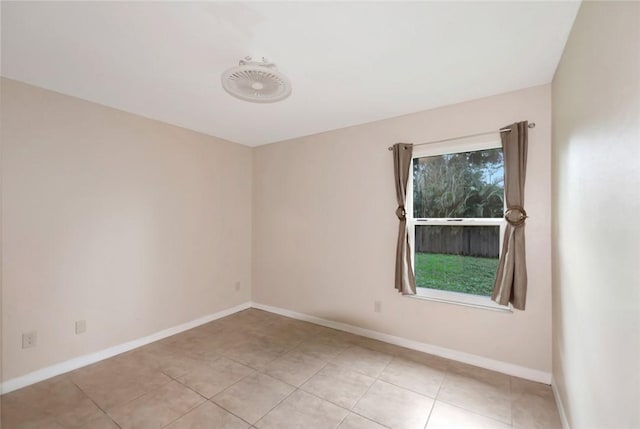 6245 6th Pl, Vero Beach, FL 32968 - empty room featuring baseboards and light tile patterned flooring