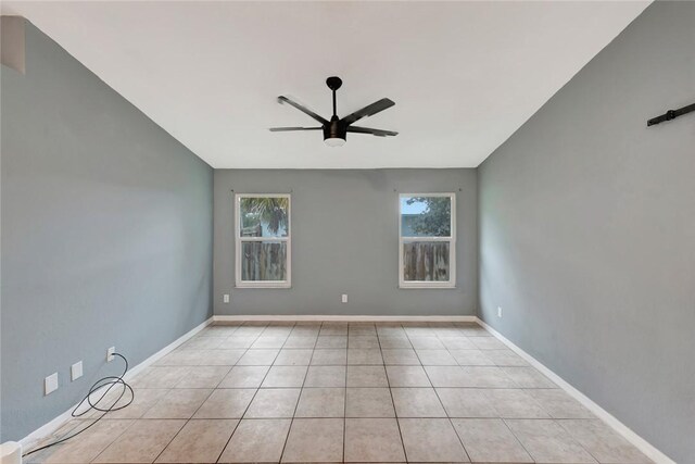 6245 6th Pl, Vero Beach, FL 32968 - tiled empty room with ceiling fan and baseboards