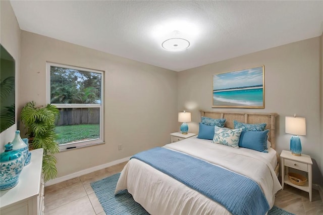 6245 6th Pl, Vero Beach, FL 32968 - bedroom with baseboards and light tile patterned flooring