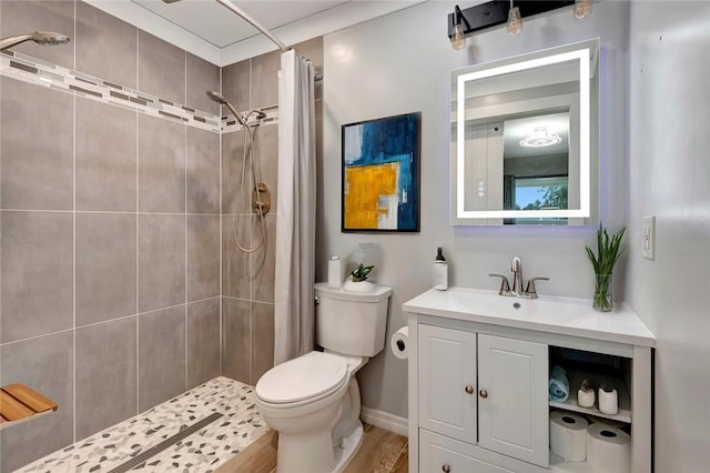 6245 6th Pl, Vero Beach, FL 32968 - bathroom featuring vanity, a tile shower, and wood finished floors