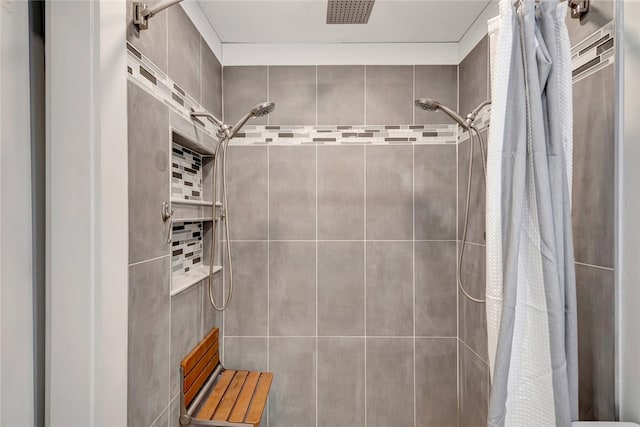 bathroom featuring a shower with curtain