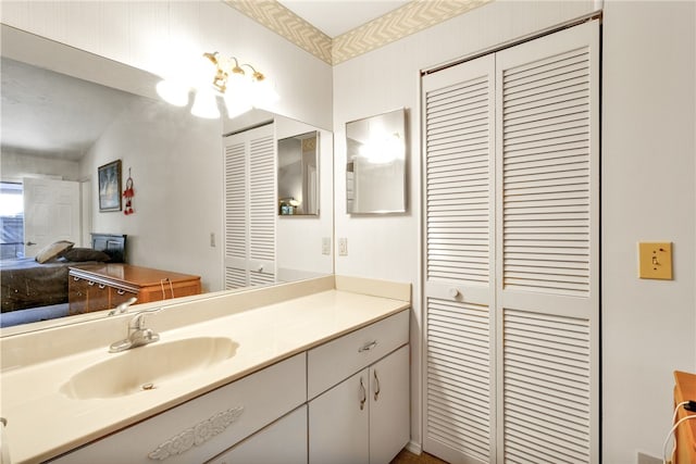 bathroom featuring vanity and vaulted ceiling