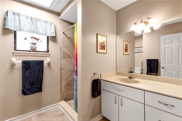 bathroom featuring vanity, tile patterned floors, and walk in shower