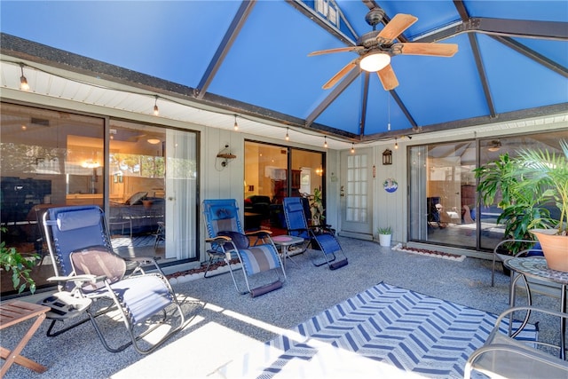 view of patio / terrace featuring glass enclosure and ceiling fan