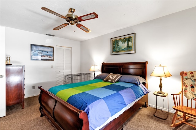 bedroom with carpet flooring, ceiling fan, and a closet