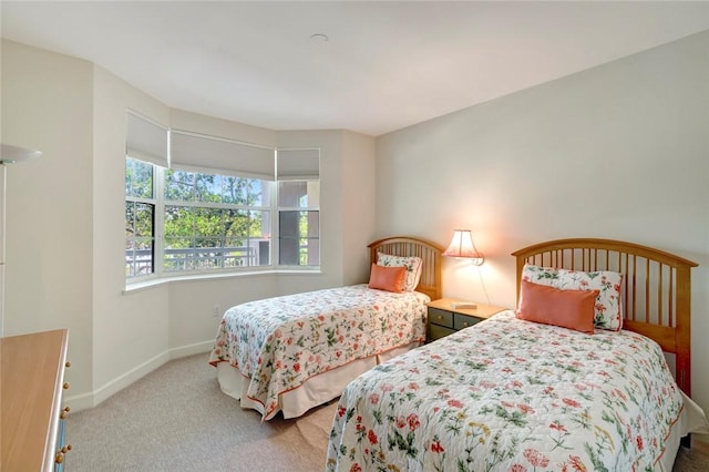bedroom with carpet and baseboards
