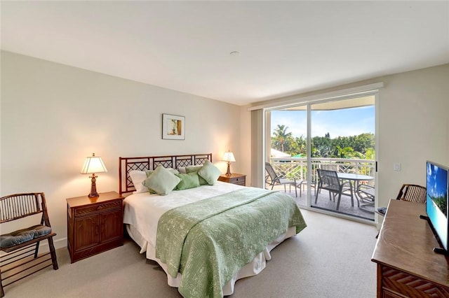 bedroom featuring light carpet and access to outside