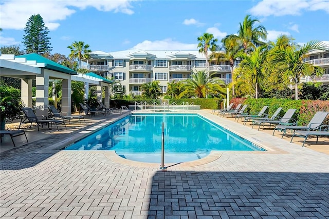 community pool with a patio area