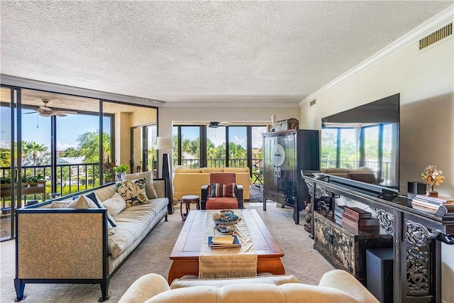 1821 Mooringline Dr Unit 3G, Vero Beach, FL 32963 - carpeted living room featuring a ceiling fan, a textured ceiling, and crown molding