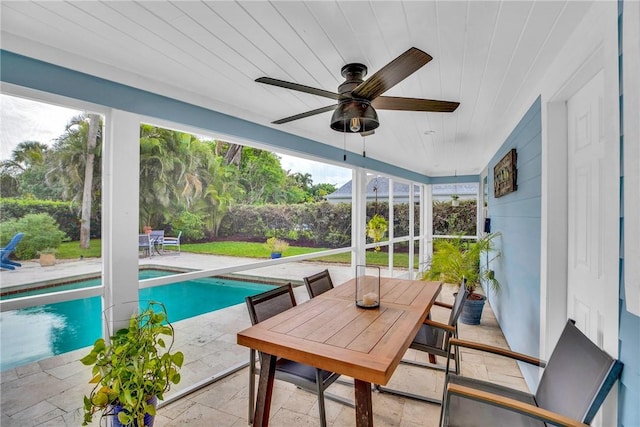 sunroom with wood ceiling and ceiling fan