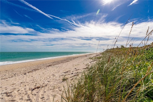 property view of water featuring a beach view