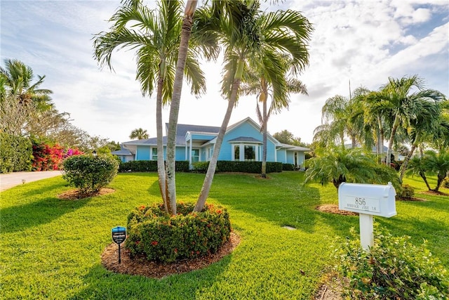 view of front of home with a front yard