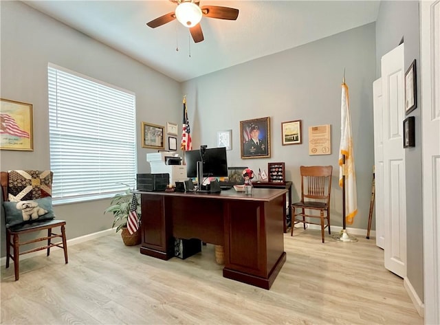 office with ceiling fan and light hardwood / wood-style floors