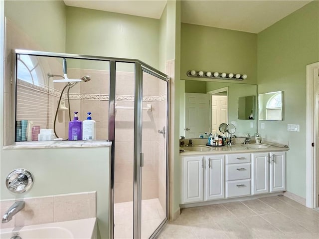 bathroom featuring separate shower and tub, tile patterned flooring, and vanity