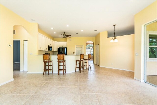 412 N Key Lime Sq SW, Vero Beach, FL 32968 - view of front facade with a front yard and a garage