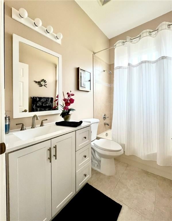 full bathroom with tile patterned floors, vanity, shower / bath combo, and toilet