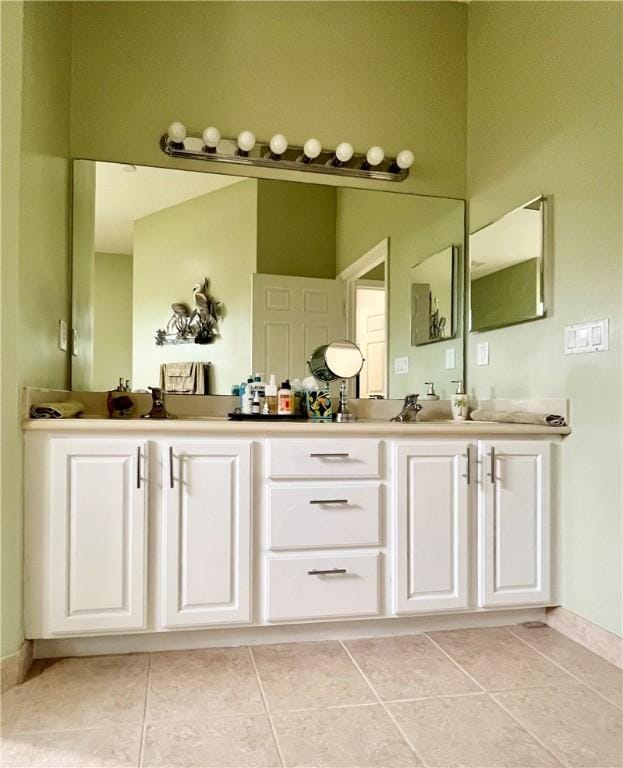 bathroom with tile patterned flooring and vanity