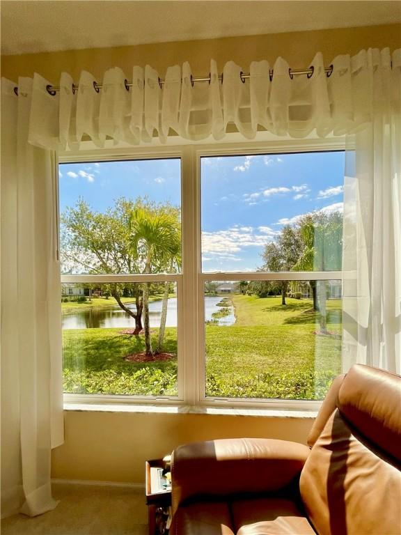 tiled living room featuring ceiling fan