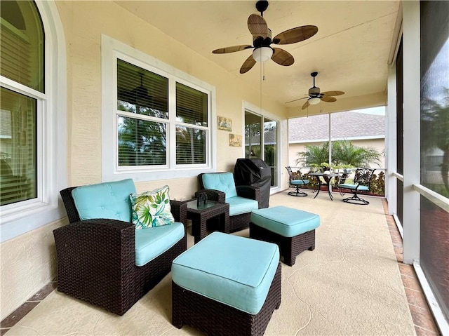 home office featuring light hardwood / wood-style flooring and ceiling fan