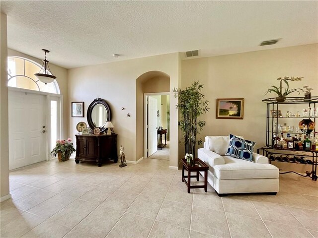 back of property with a lawn and a sunroom