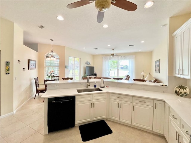 kitchen featuring kitchen peninsula, white cabinets, sink, light tile patterned floors, and dishwasher