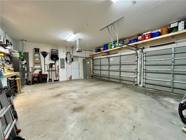 garage featuring electric panel and a garage door opener