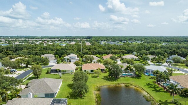 412 N Key Lime Sq SW, Vero Beach, FL 32968 - garage featuring electric panel and a garage door opener