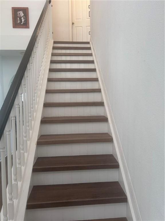 2523 12th Sq SW, Vero Beach, FL 32968 - stairway featuring baseboards