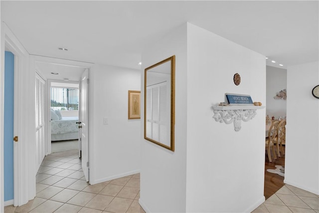 corridor featuring light tile patterned flooring