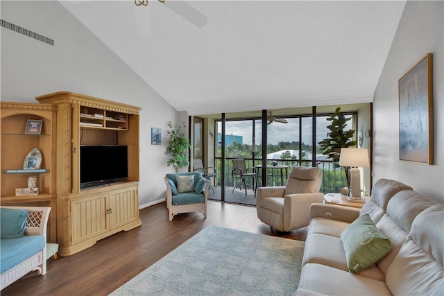 living room featuring ceiling fan, dark hardwood / wood-style flooring, and high vaulted ceiling