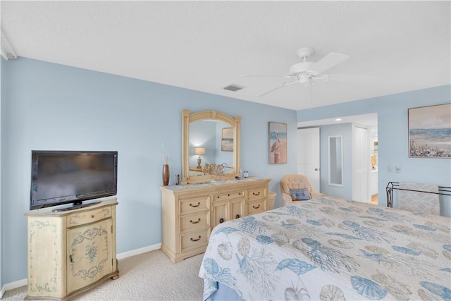 bedroom with ceiling fan and light carpet