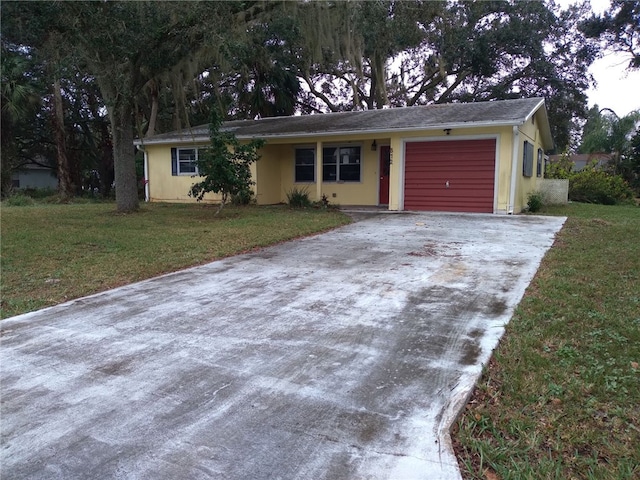 ranch-style home with a front lawn and a garage