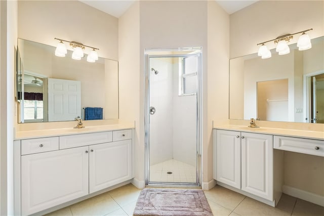 bathroom featuring tile patterned flooring, vanity, and an enclosed shower